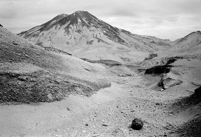 Griggs Volcano and a large pumice stone along the upper Knife Creek drainage, 2004.  (© Gary Freeburg)